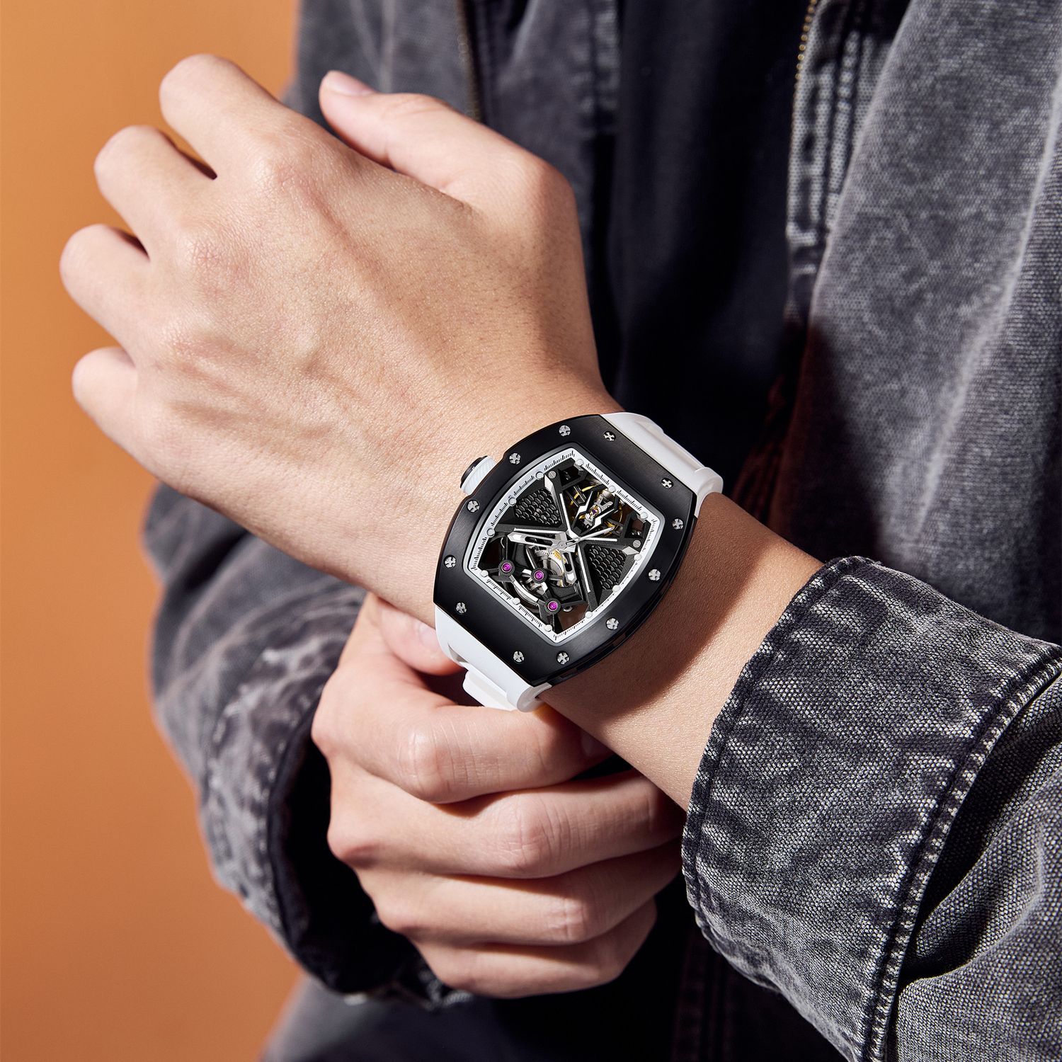 MEGIR 9190-5 spider skeleton automatic watch on the wrist, black case and white silicone strap