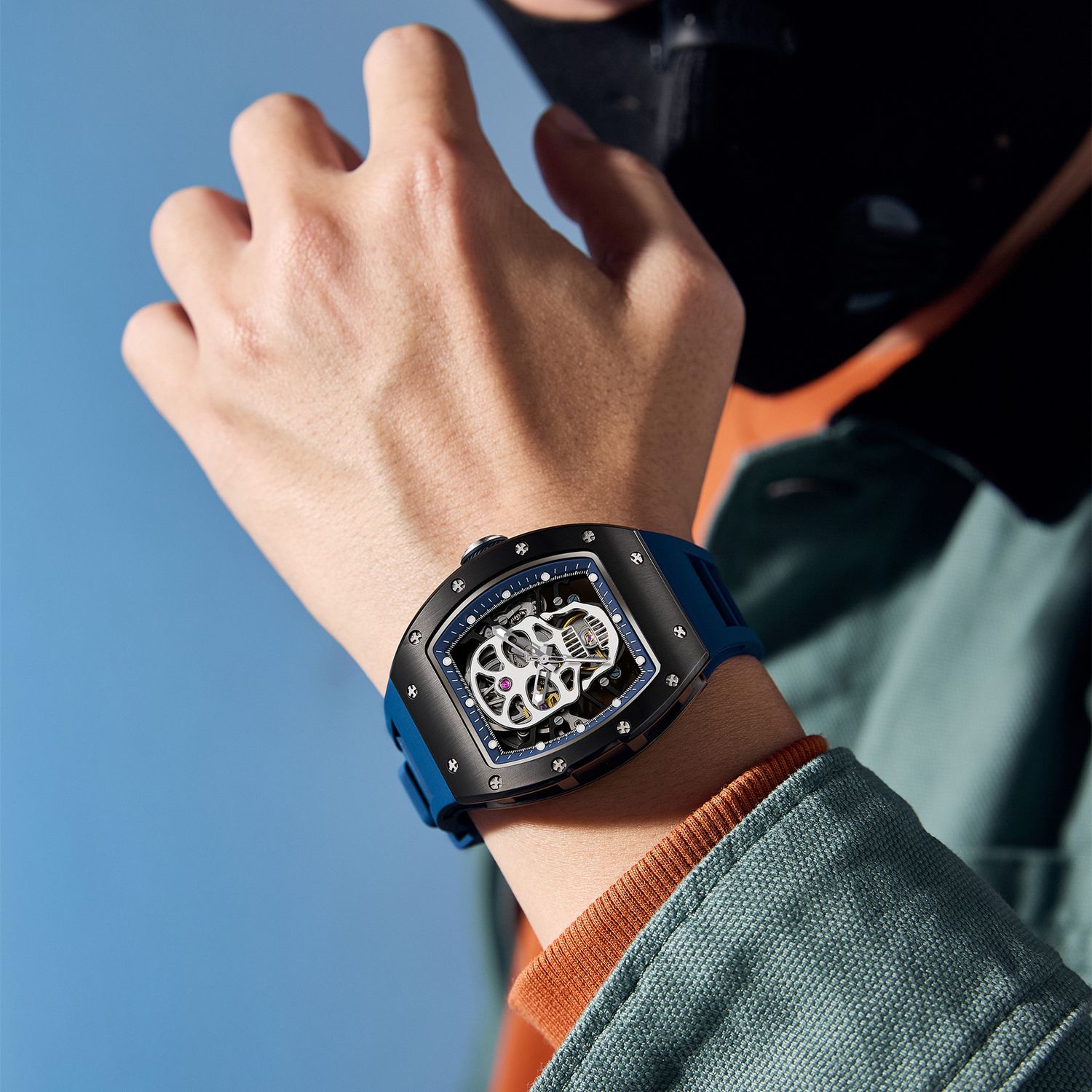 MEGIR 9190-7 skull skeleton automatic watch on the wrist, black case and blue silicone strap
