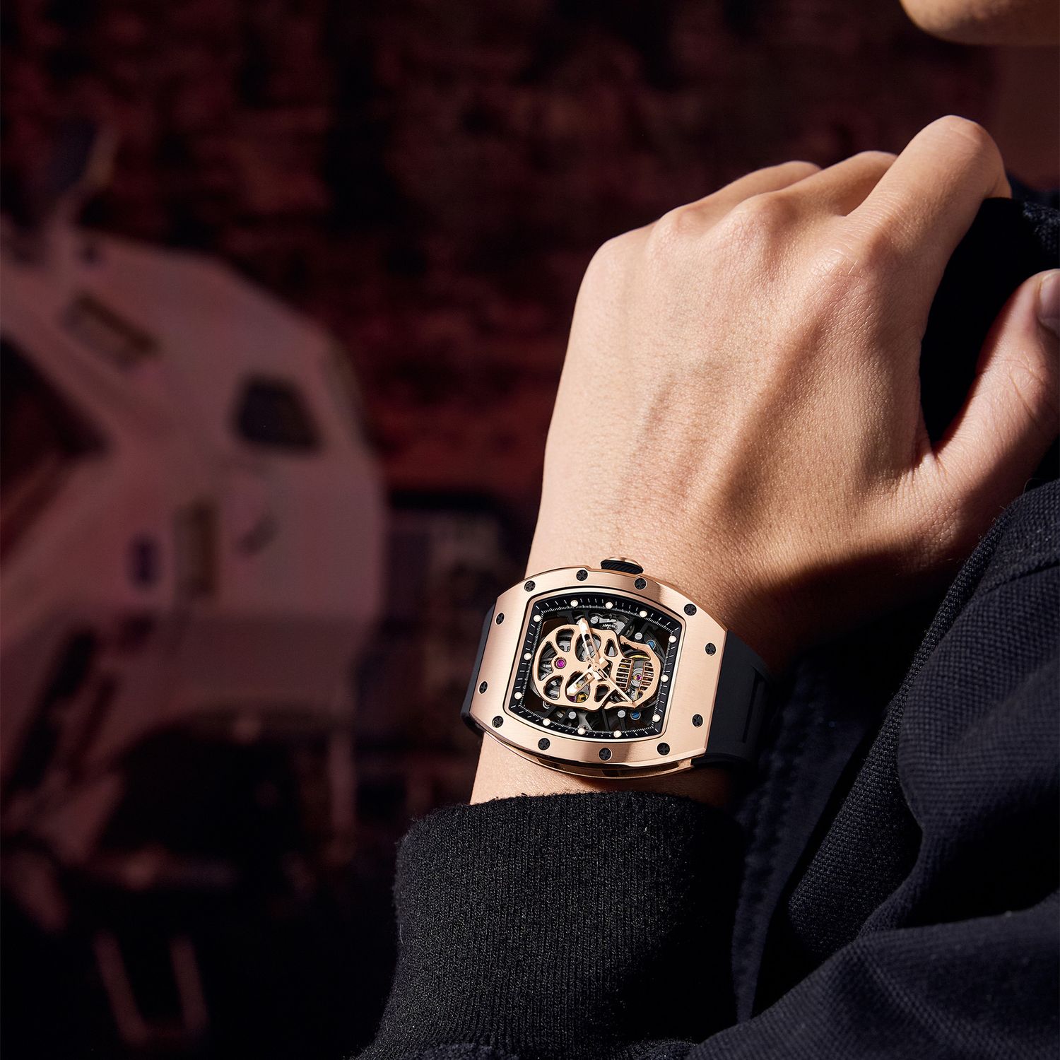 MEGIR 9190-7 skull skeleton automatic watch on the wrist, rose-gold case and black silicone strap