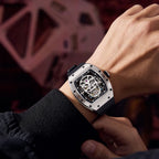 MEGIR 9190-7 skull skeleton automatic watch on the wrist, silver case and black silicone strap