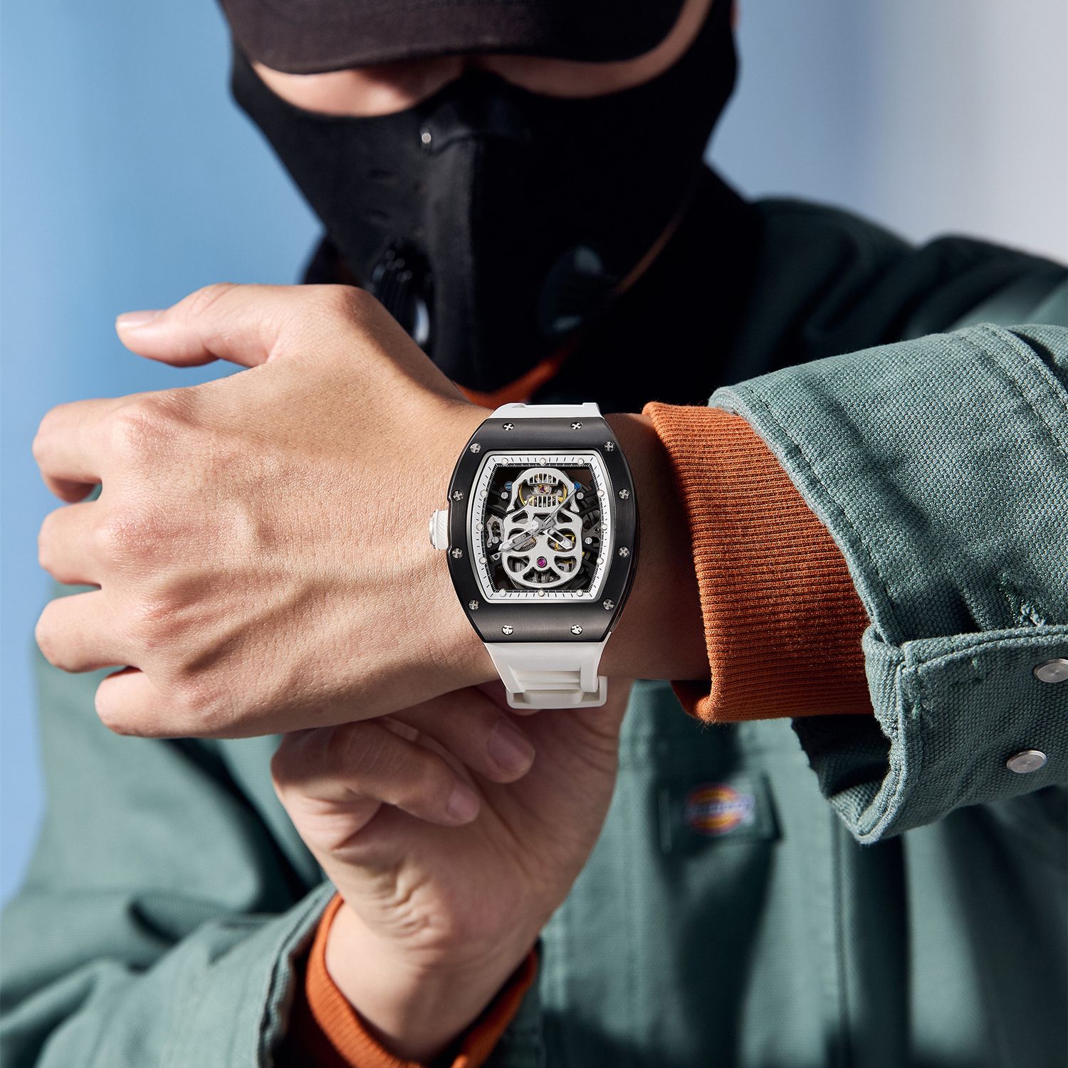 MEGIR 9190-7 skull skeleton automatic watch on the wrist, black case and white silicone strap