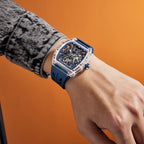 MEGIR 9195-11 skeleton automatic watch on the wrist, transparent case and dark blue silicone strap
