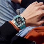 MEGIR 9198-1 skeleton automatic watch on the wrist, silver case and turquoise silicone strap