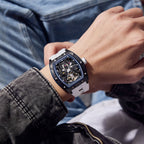MEGIR 9198-1 skeleton automatic watch on the wrist, black case and white silicone strap