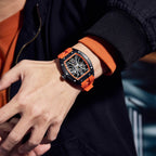 MEGIR 9198-4 skeleton automatic watch on the wrist, black case and orange silicone strap