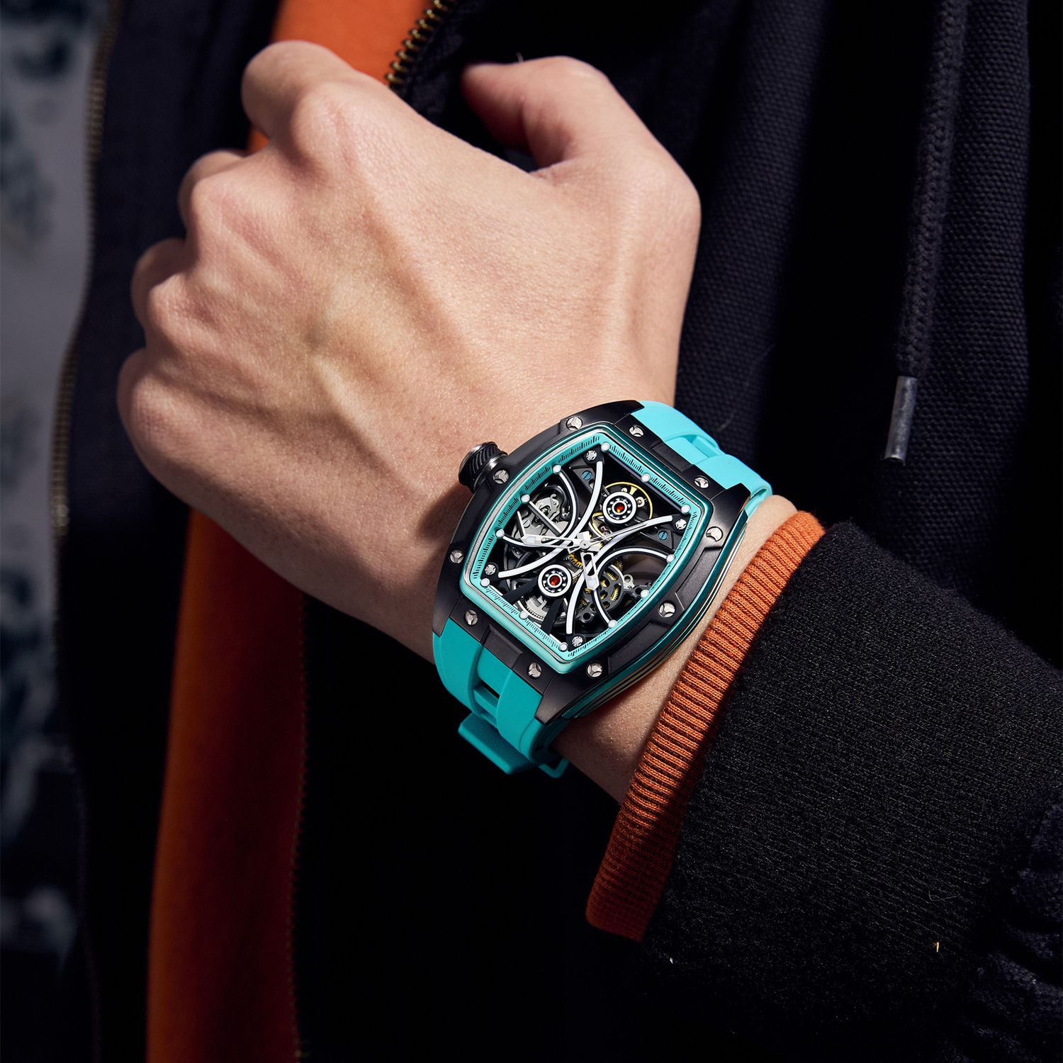 MEGIR 9198-4 skeleton automatic watch on the wrist, black case and turquoise silicone strap