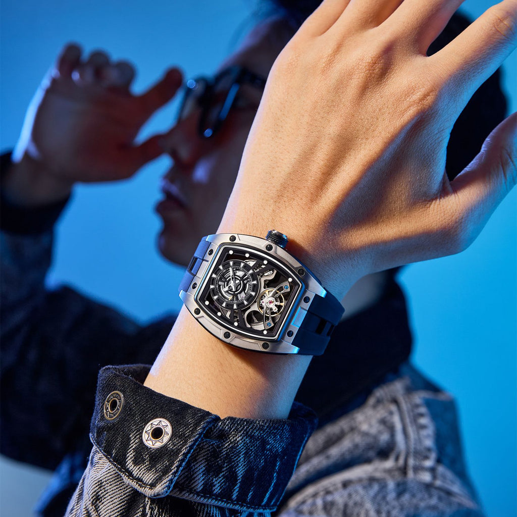 MEGIR 9198-6 skeleton automatic watch on the wrist, silver barrel case and blue silicone strap