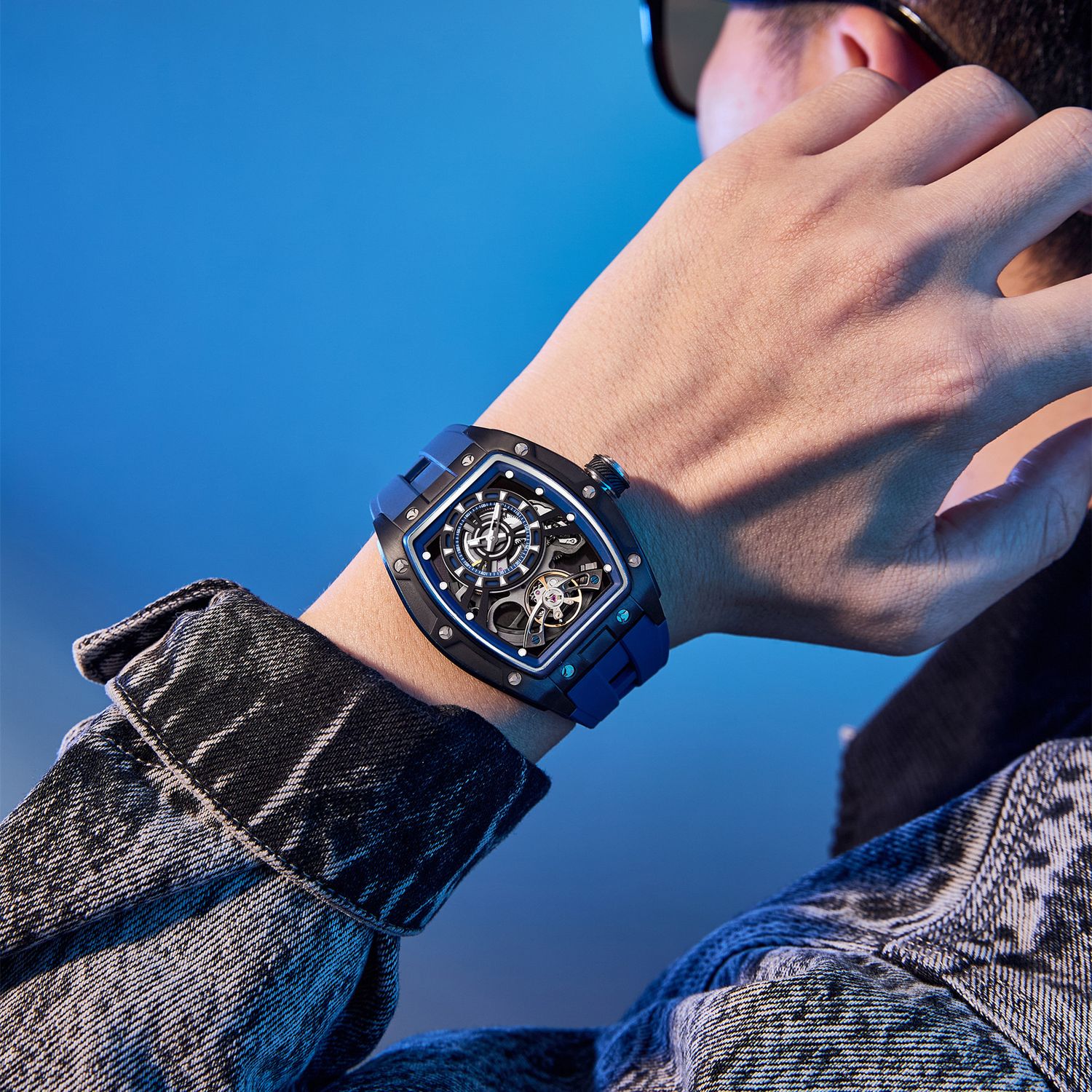 MEGIR 9198-6 skeleton automatic watch on the wrist, blue case and blue silicone strap