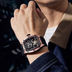MEGIR 9198-6 skeleton automatic watch on the wrist, rose-gold barrel case and black silicone strap, at night