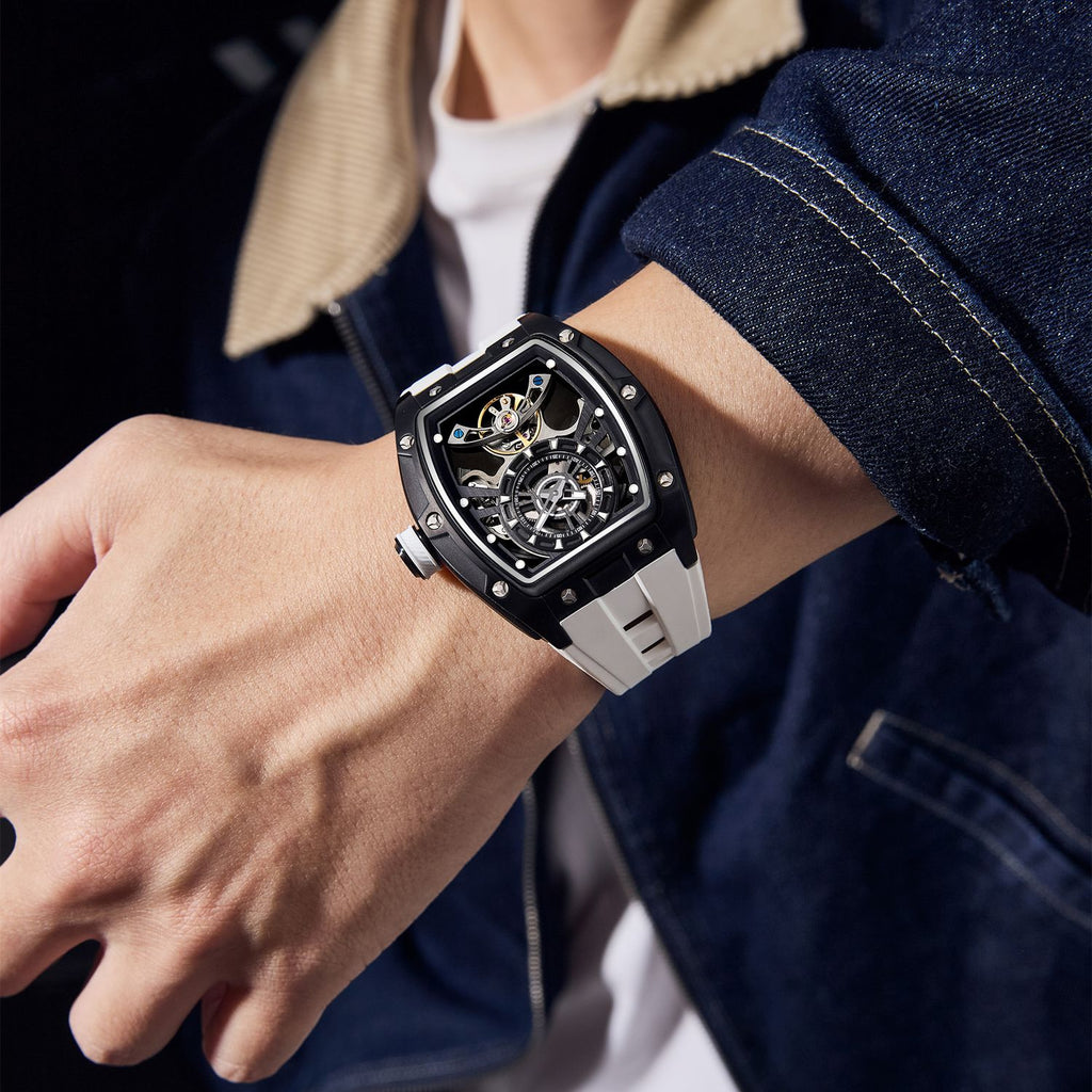 MEGIR 9198-6 skeleton automatic watch on the wrist, black case and white silicone strap