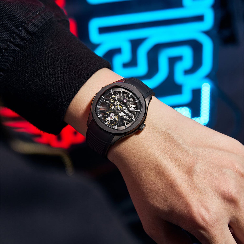 MEGIR 9204-5 skeleton automatic watch, black case, dark dial and black silicone strap, on the wrist