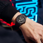 MEGIR 9204-5 skeleton automatic watch, black case, dark dial and black silicone strap, on the wrist