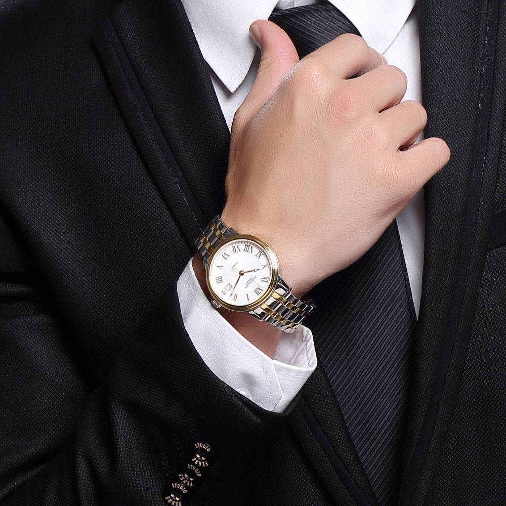 MEGIR 96001 automatic watch on the wrist with a dark suit, white Roman-numeral dial, two-tone bracelet