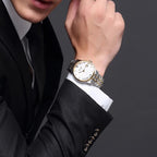 MEGIR 96002 automatic dress watch worn with a black suit, two-tone steel bracelet, wrist lifestyle view