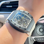 MEGIR quartz chronograph watch with skeleton dial and white strap on wrist in car