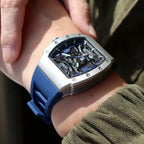 MEGIR MN8603GWE-7 automatic skeleton tonneau watch with blue silicone strap on wrist