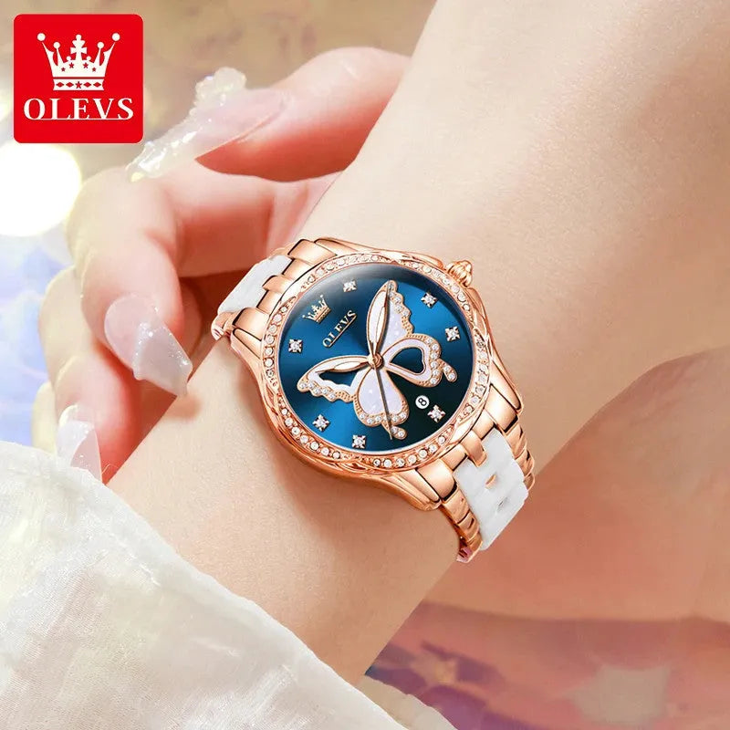 OLEVS luxury butterfly diamond womens watch with blue dial worn on wrist