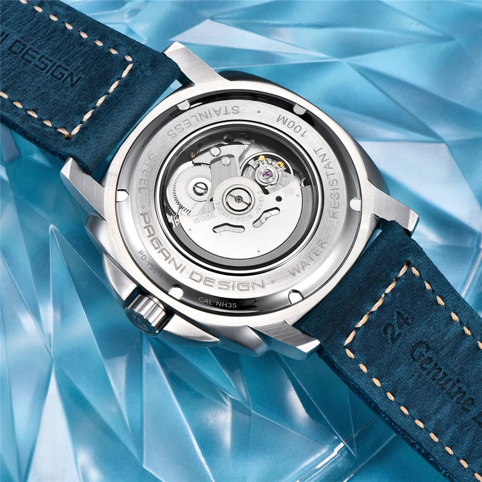 Caseback view of Pagani Design H35A automatic mechanical watch showcasing the NH35A movement through the transparent exhibition case back, with silver stainless steel case and dark blue suede strap.