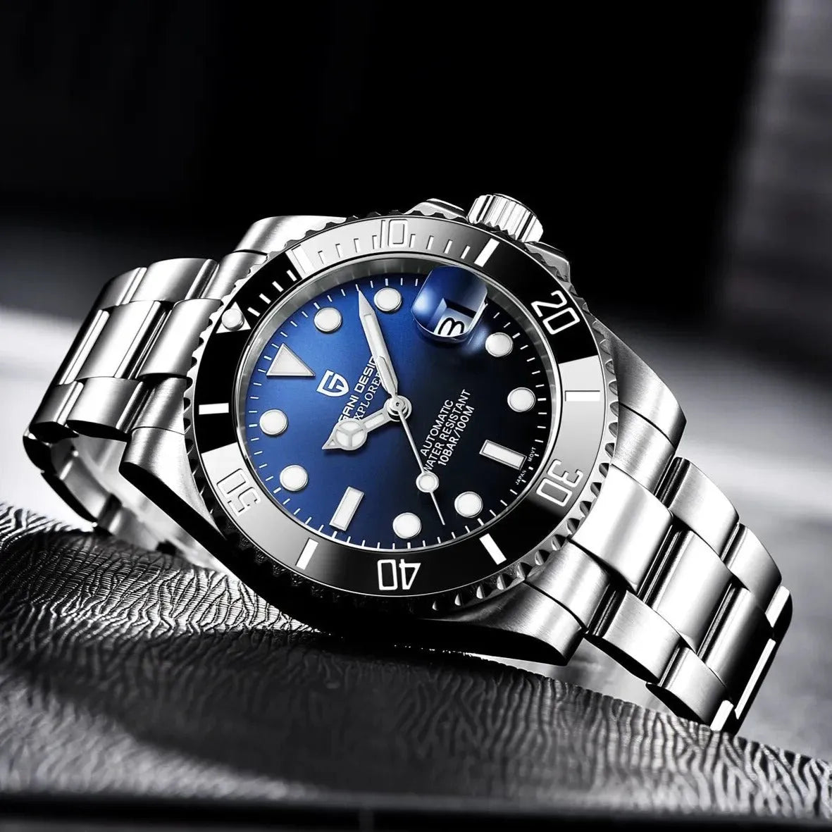 Pagani Design PD-1661 blue dial catching light on a textured surface, applied lume markers