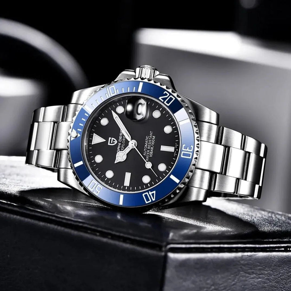 Pagani Design PD-1661 black dial blue bezel watch propped on a leather box, bracelet extended