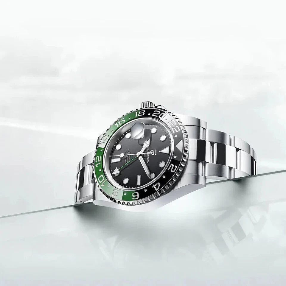 PAGANI Design PD-1662 GMT watch with black sprite bezel and steel bracelet on glass surface