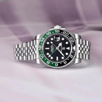 PAGANI DESIGN PD-1662 GMT men's watch with black dial green black bezel jubilee bracelet detail on purple satin