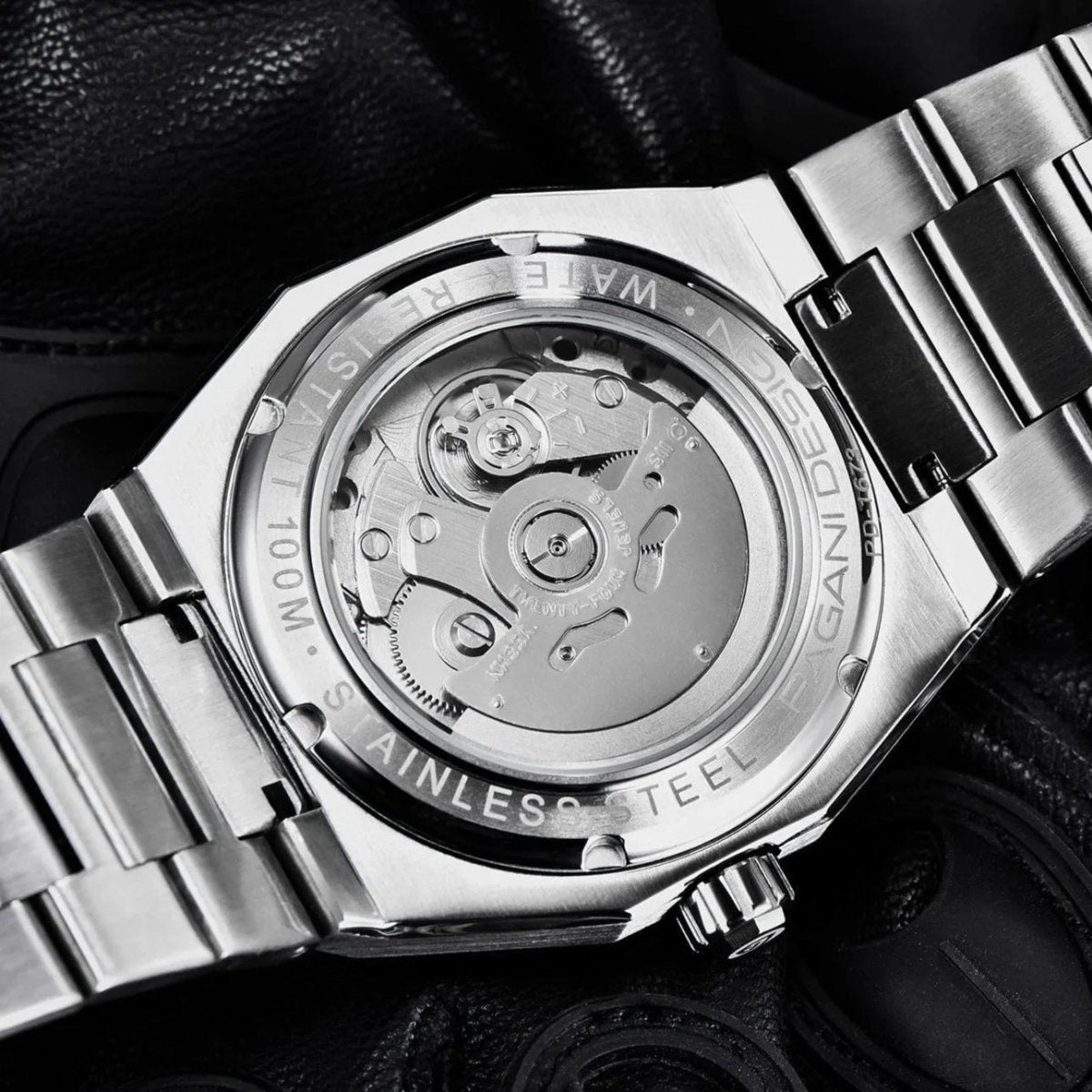 Pagani Design PD-1673 exhibition caseback showing the automatic movement and 100M steel case marks