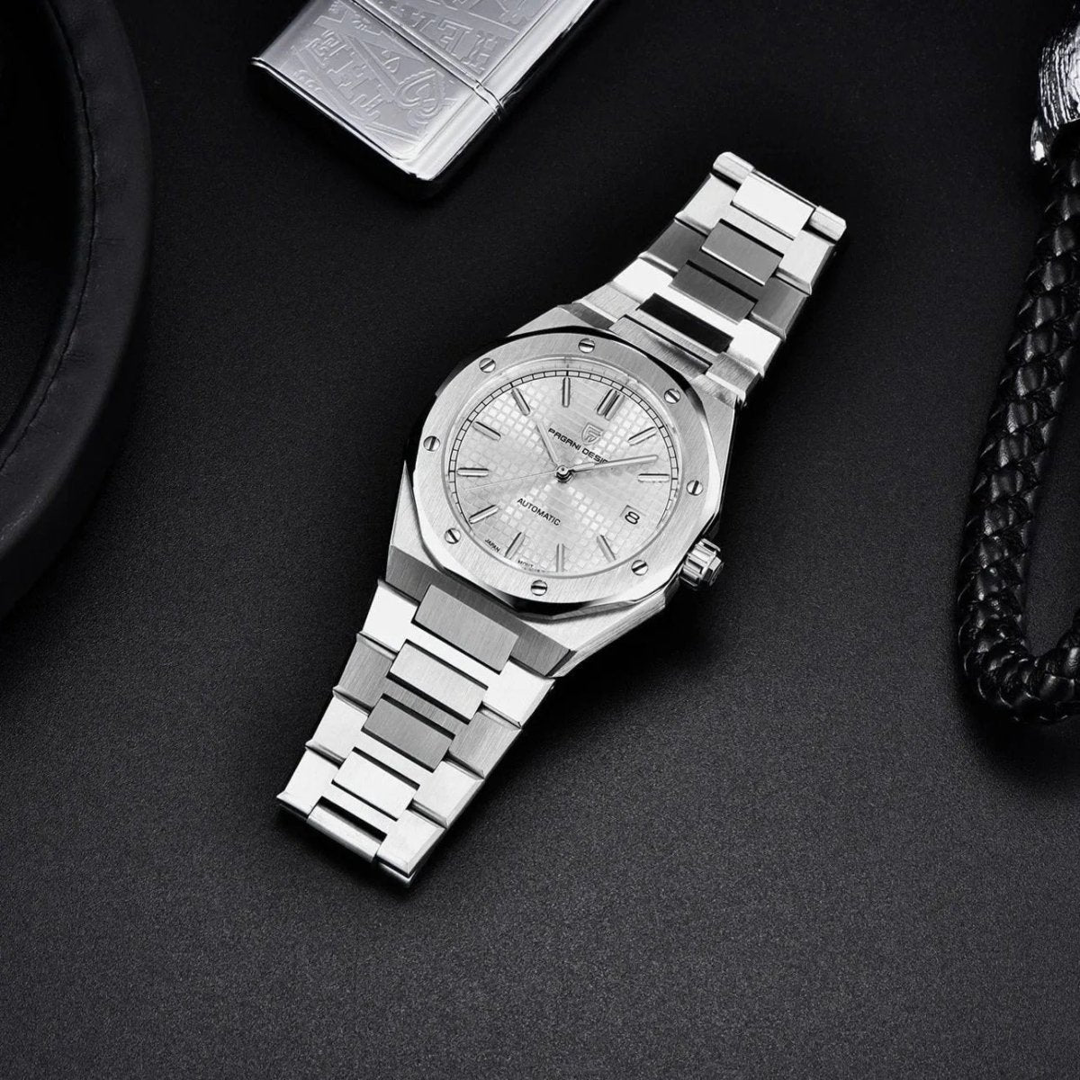 Pagani Design PD-1673 white dial flatlay with lighter and leather, bracelet links seen from above