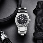 Pagani Design PD-1673 black dial flatlay with leather gloves, showing bracelet and date window at 3