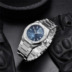 Pagani Design PD-1673 blue dial staged with leather driving gloves, showing bracelet taper and crown