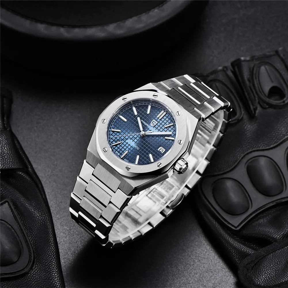 Pagani Design PD-1673 blue dial staged with leather driving gloves, showing bracelet taper and crown