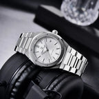 Pagani Design PD-1673 white waffle dial on headphones, light catching the polished bracelet links