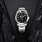 Pagani Design PD-1692 black dial laid on black leather, showing polished bezel and steel bracelet