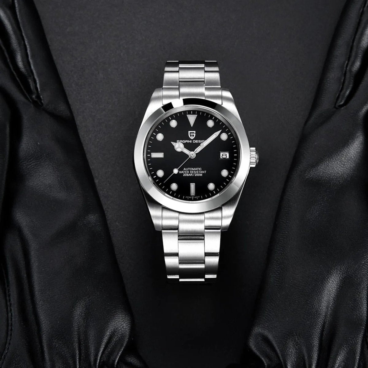 Pagani Design PD-1692 black dial laid on black leather, showing polished bezel and steel bracelet