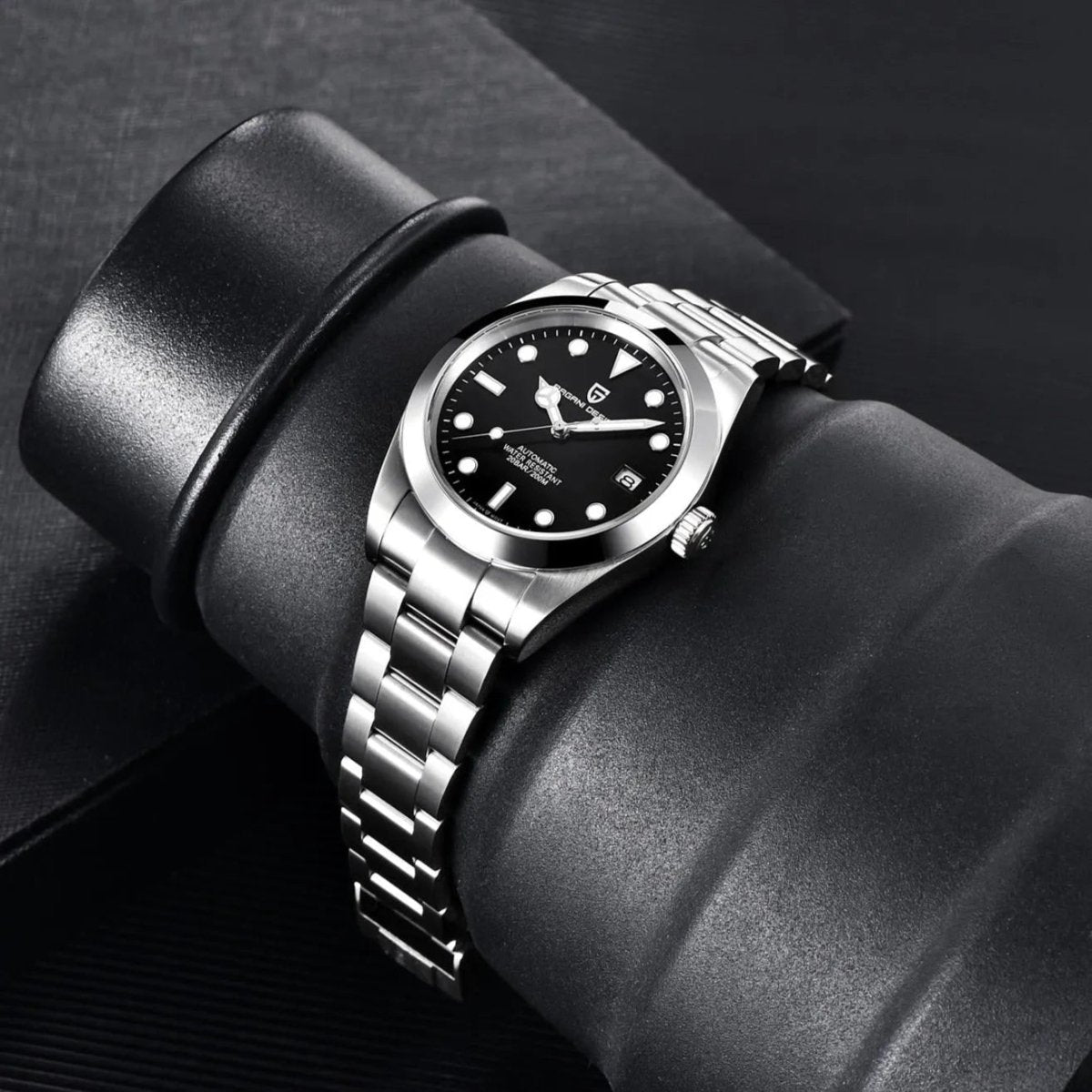 Pagani Design PD-1692 black dial draped over a leather roll, showing steel bracelet flexibility