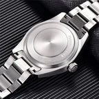 PAGANI DESIGN PD-1717 automatic pilot watch on wrist with blue dial and stainless steel bracelet
