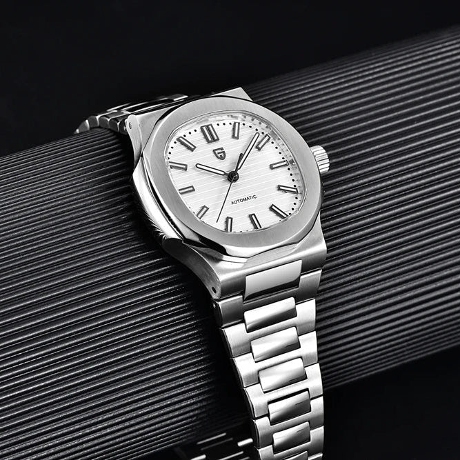 Pagani Design PD-1728 white dial and steel bracelet photographed against a ribbed black backdrop