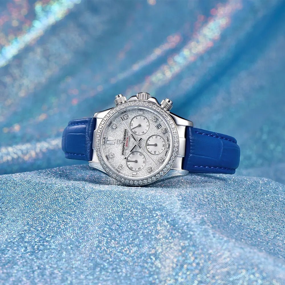 Pagani Design PD-1730 blue leather strap on a shimmering blue backdrop, crystal-set steel bezel