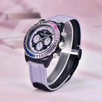 Pagani Design PD-1732 purple edition angled on a pink backdrop, gem-set bezel catching light