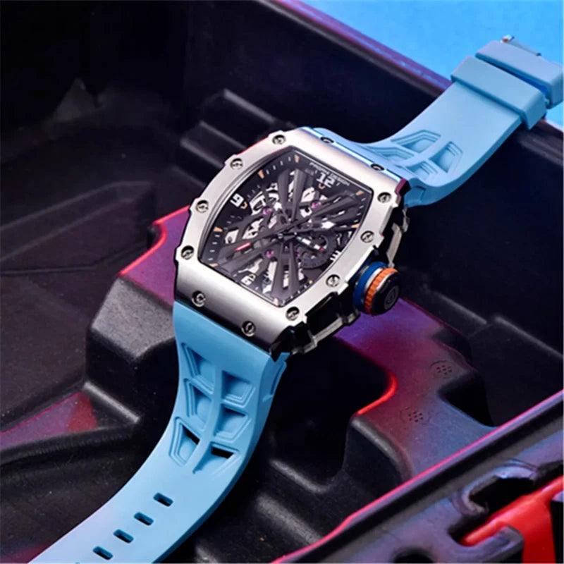 PAGANI DESIGN PD-1738 MILLE skeleton watch with light blue strap on textured case prop
