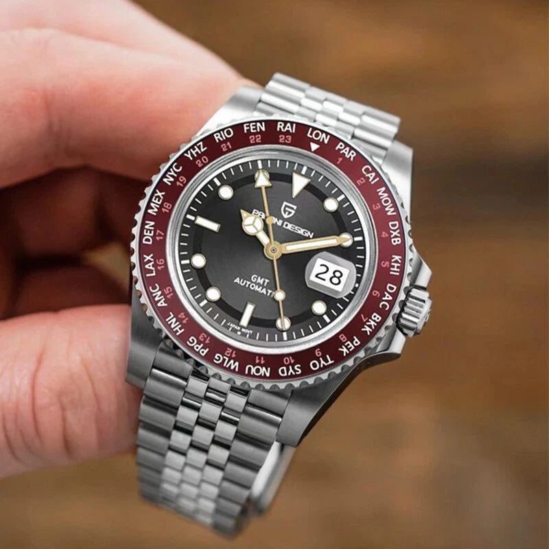 PAGANI DESIGN PD-1758 GMT automatic watch with black dial and red bezel held in hand