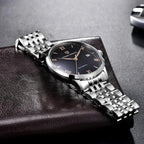 Pagani Design PD-1759 black dial with rose gold Roman numerals on a steel bracelet, angled view