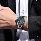 PAGANI DESIGN PD-1773 pilot chronograph watch with blue dial worn on wrist with suit
