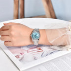 PAGANI DESIGN PD-1776 womens watch worn on wrist with blue dial and diamond bezel lifestyle