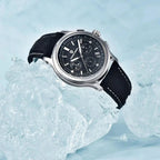 Pagani Design PD-1781 black dial chronograph resting on ice with its black canvas strap