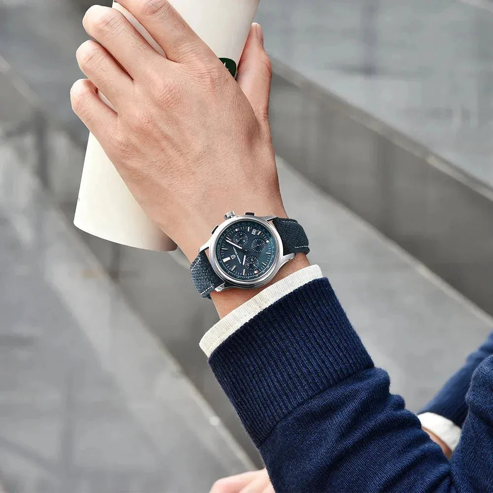 Pagani Design PD-1781 blue dial chronograph worn on the wrist under a navy sweater cuff