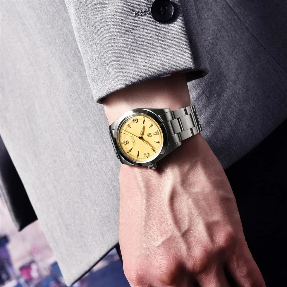PAGANI DESIGN PD-1785 automatic NH35A watch with champagne yellow dial worn on wrist with blazer
