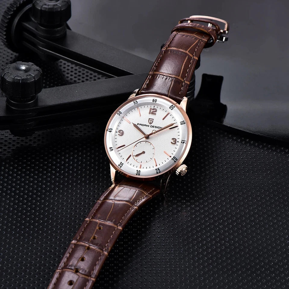 PAGANI DESIGN PD-1790 automatic dress watch with white dial and rose gold case, flat lay on dark surface