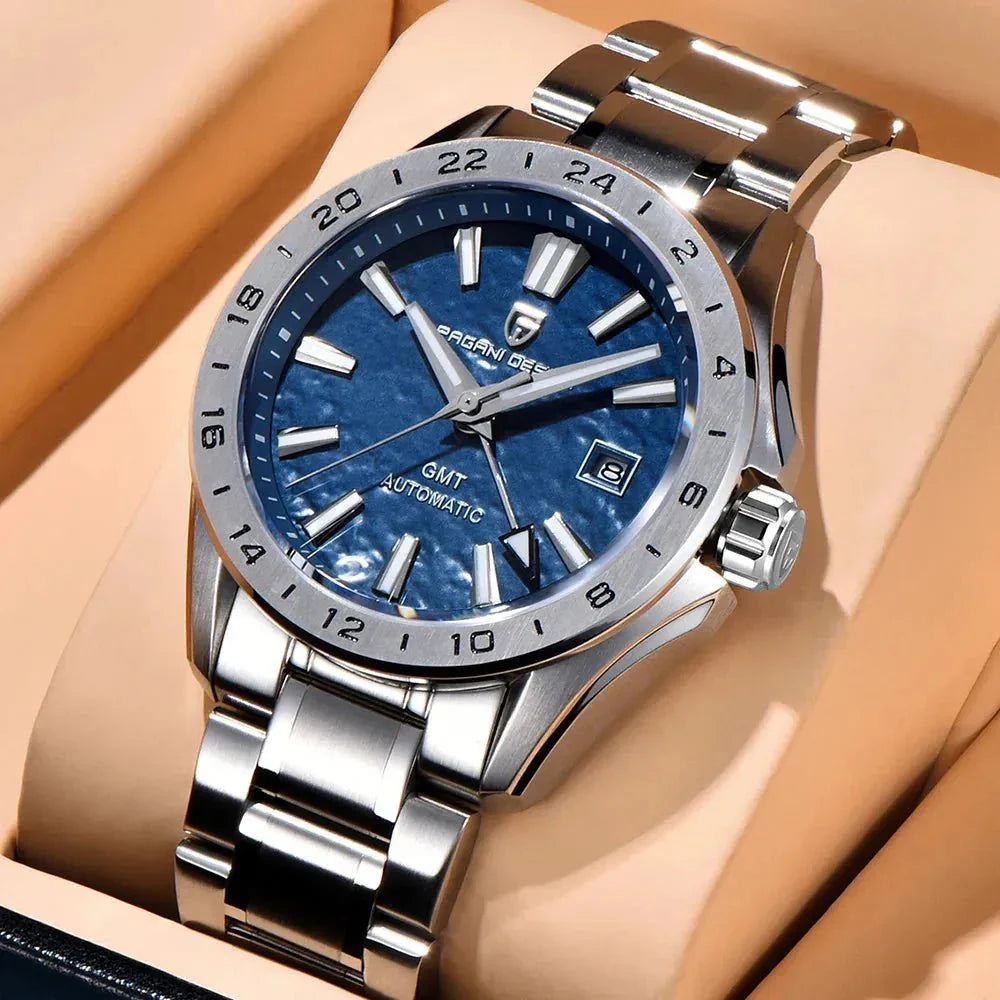 Pagani Design PD-1792 blue GMT dial resting on a tan cushion, crown and bracelet in view