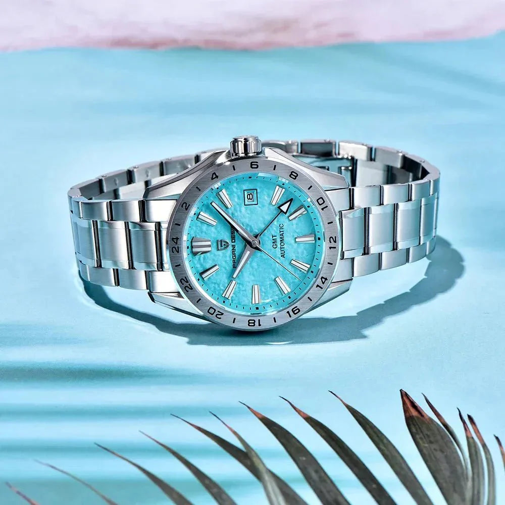 Pagani Design PD-1792 sky blue GMT dial styled on an aqua backdrop with palm leaves